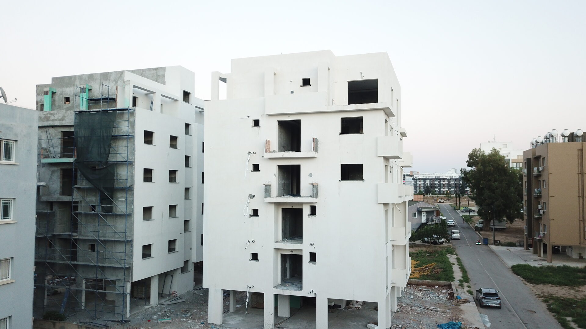 Saffron — both blocks viewed from street level against the sky